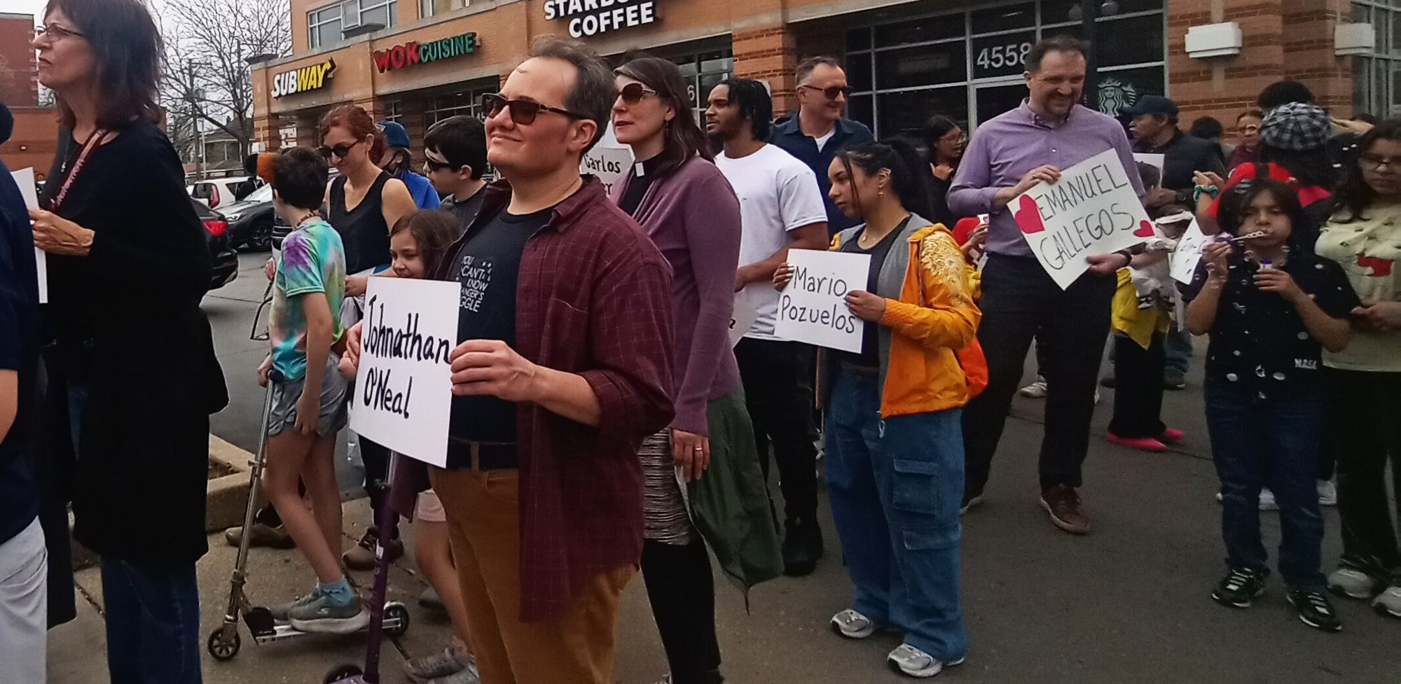 Moveable Feast members marching with signs on a Chicago street