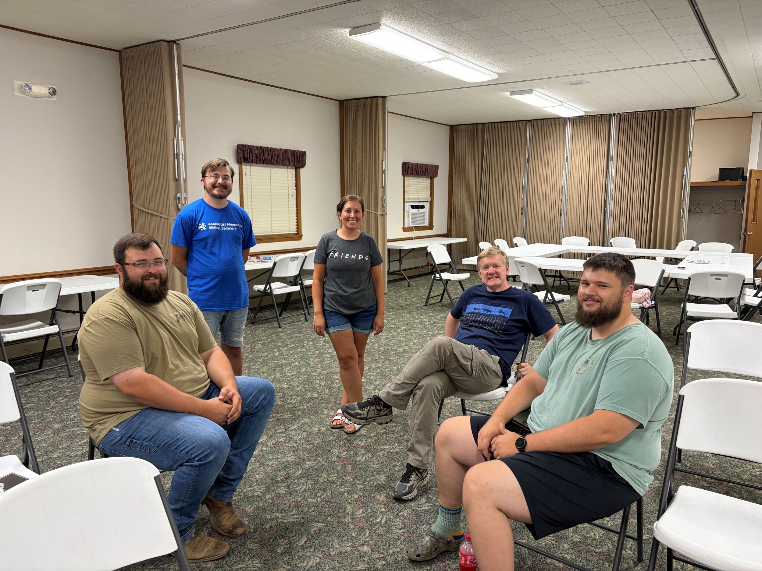 Members of New Life Fellowship sitting together in a circle of chairs