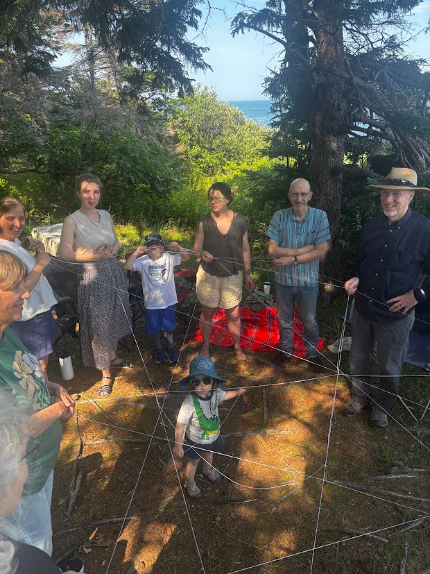 Peace by the Waters gathered in a circle outdoors for Wild Church